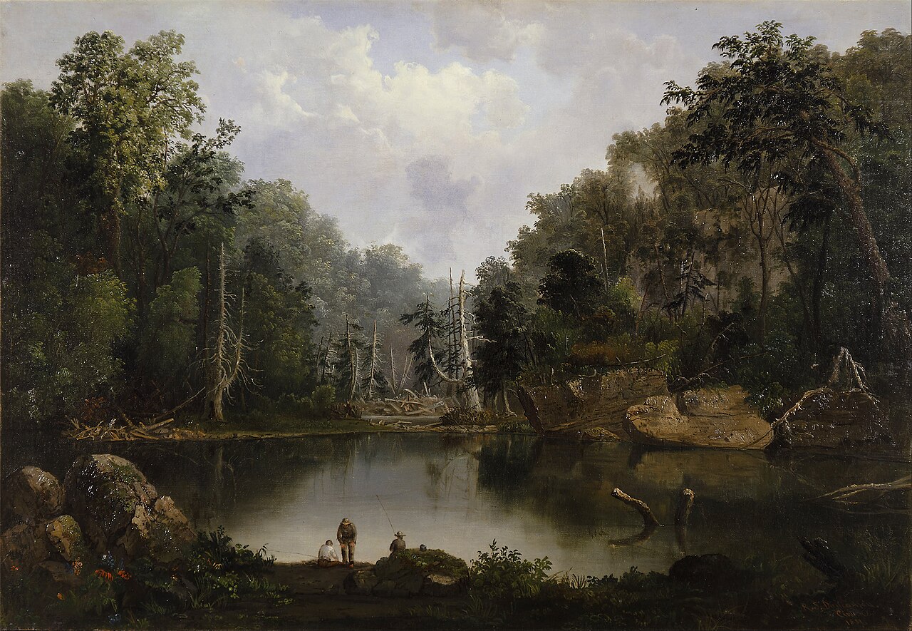 A river bend with trees and a pale sky